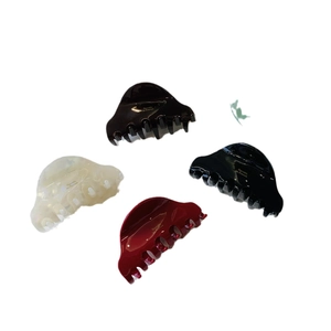 Set of four French acetate cloud hair claws in black, white, and cherry red colors