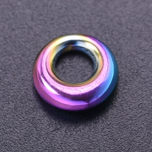 Macro view of rainbow stainless steel hollow circle pendant for jewelry making