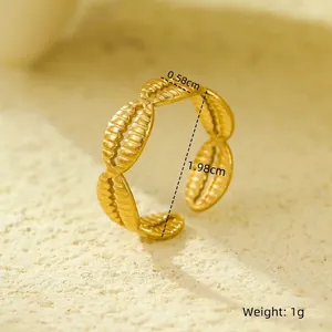 Detailed view of 18K gold plated open ring featuring textured wheat leaf patterns