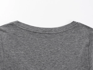 Close-up of gray V-neck T-shirt showing fine knit wool texture and stitching quality
