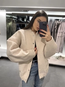Women's oversized beige sherpa jacket with metal buttons and drop shoulder design