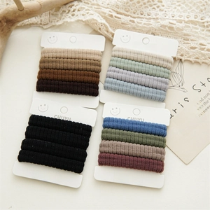 Detail of high-elastic seamless hair ties in assorted Morandi colors on display cards