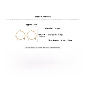 Detail view of gold star hoop earrings with dimensions 3.5cm x 3cm and 4.3g weight