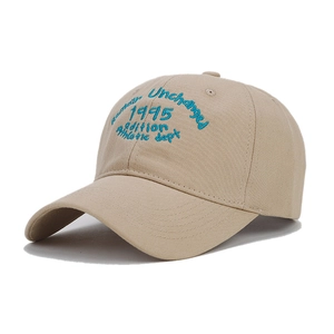 Classic beige cotton baseball cap featuring blue vintage athletic letter embroidery