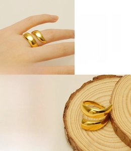Macro detail of geometric double-layered open ring with 18k gold plating finish