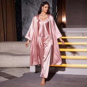 Three-piece satin pajama set for women including a robe, camisole, and pants in lotus pink