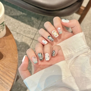 Handmade press-on nails with 3D stars, pearls and blue gradient cat-eye effect