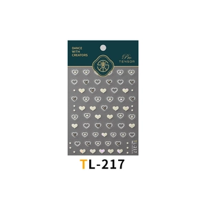 Detailed view of heart-shaped nail stickers with rhinestones and shell light finish