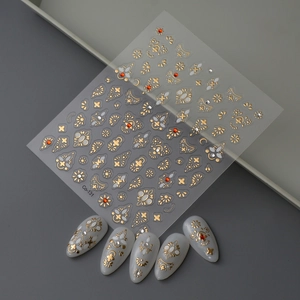 Golden flower nail art stickers with red rhinestones and bohemian style decorations
