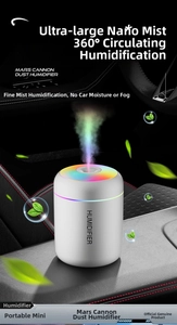 Detailed close-up of portable mini humidifier with RGB rainbow light in car interior