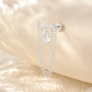 Macro detail of S925 sterling silver cartilage stud with zircon tassel and flat back screw