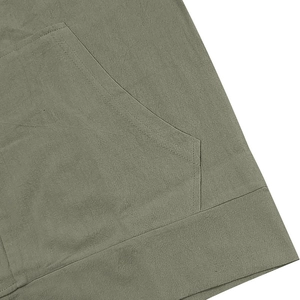 Detail of army green linen blend hoodie showing pocket stitching and hem texture