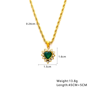 Detail view of heart pendant dimensions and twisted gold chain specs for sweater necklace