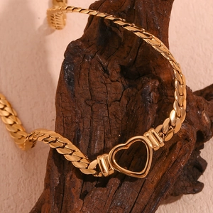 18K gold plated stainless steel choker featuring a hollow heart pendant on flat chain