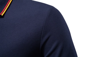 Detail of navy blue polo shirt with textured cotton fabric and tricolor striped collar