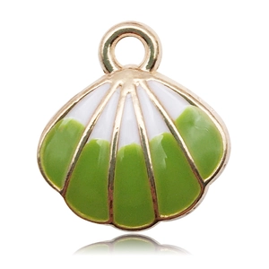 Detail of a gold-rimmed shell pendant with green and white enamel finish for DIY jewelry