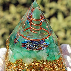 Natural crystal resin pyramid with green stone and Hamsa Hand symbol for home decor