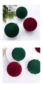Detail of 8cm flocked Christmas balls in dark green and burgundy with velvet texture