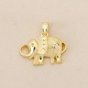 Macro shot of gold-plated elephant pendant with intricate textured engraving details
