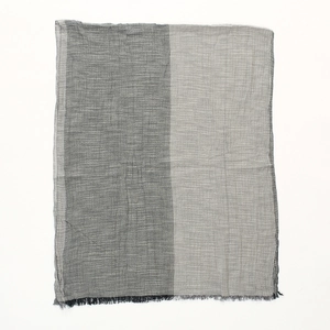 Detail of grey color-block men scarf with fringe edges and lightweight textured fabric