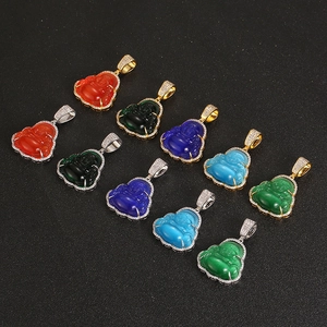 Detailed view of colorful laughing Buddha pendants with sparkling rhinestone frames