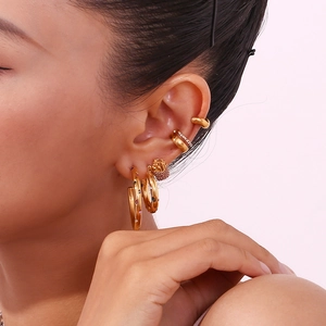 18K gold plated stainless steel earrings set with colorful cubic zirconia on model