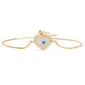 Adjustable 18K gold plated heart bracelet featuring a blue evil eye and sparkling crystals