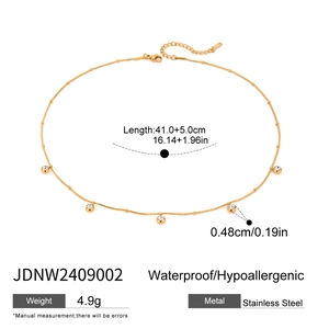 Macro detail of waterproof 18K gold stainless steel chain with zircon charms