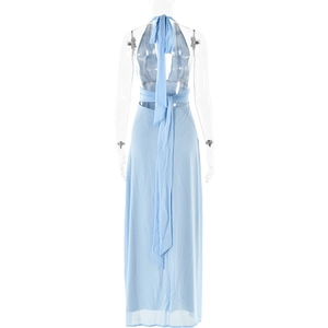 Detail view of the backless halter design and lace-up tie on a blue maxi dress