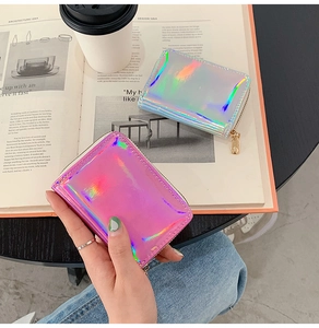 Close-up of holographic laser card holders with zip closure in pink and blue finishes