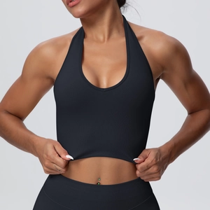 Detail of high-stretch seamless knitted fabric texture on black halter yoga vest
