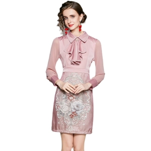 Elegant pink long sleeve dress with mesh sleeves and floral embroidery detail