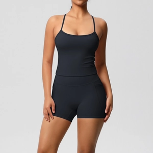 Detail of black yoga set with spaghetti strap sports bra and high-waisted shorts with side pocket