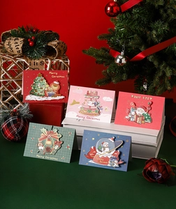 Detailed close-up of 3D pop-up Christmas cards with colorful festive ornaments