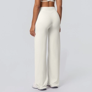Rear view of white high-waisted yoga flare pants showing slimming fit and smooth drape