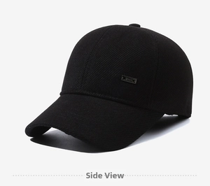 Side view detail of a black winter baseball cap featuring a small metal brand plate
