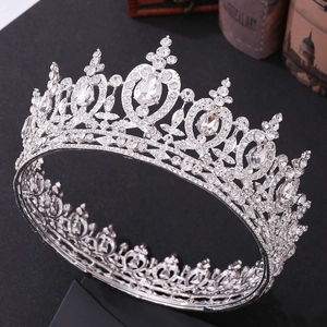 Elegant silver bridal crown with heart-shaped crystal rhinestones on a black background