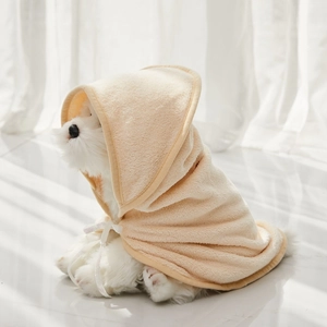 Close-up of cream-colored hooded pet bathrobe with soft microfiber coral fleece texture