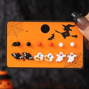 Spooky Halloween stud earrings set with cartoon bats ghosts and pumpkins on orange card