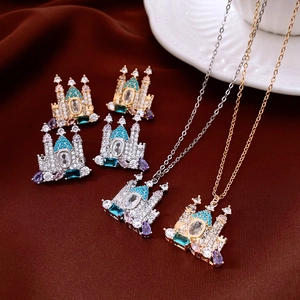 Close-up of 18K gold and silver plated castle necklaces with sparkling zircon stones