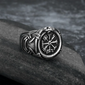 Viking Vegvisir compass axe ring in vintage silver finish on a dark textured rock