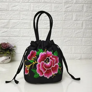 Ethnic style black canvas bucket bag featuring exquisite peony floral embroidery and drawstring