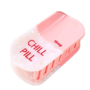 Pink and white pill-shaped hair claw clip with Chill Pill engraving for women