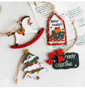 Detailed view of 4-piece wooden Christmas ornaments including rocking horse and sled