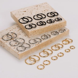 Polished 18K gold-plated stainless steel hoop earrings in gold, silver, and black finishes