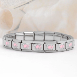 Close-up of stainless steel Italian charm bracelet with pink dual heart design