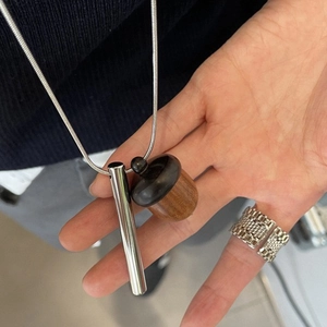 Creative wooden acorn pendant necklace with polished silver cylinder on a sleek snake chain