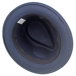 Detail view of navy blue fedora interior showing 57cm size tag and cotton blend lining