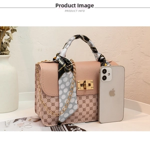 Pink printed small square handbag with golden chain strap and polka dot silk scarf detail