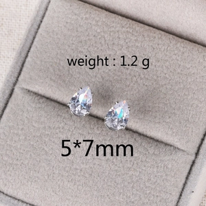 Macro view of teardrop zircon earrings with 1.2g weight and 5x7mm size detail
